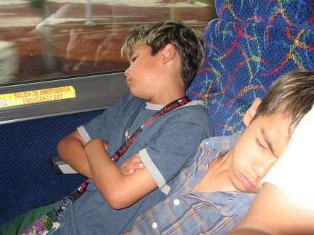 Kids sleeping on the bus